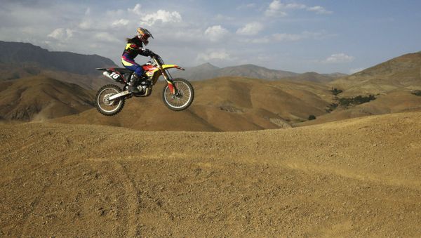 Iranian Behnaz Shafiei rides her motocross bike during her training session at a racetrack in the Alborz mountain range near the village of Baraghan, some 19 miles (30 kilometers) west of the capital Tehran, Iran - Sputnik International
