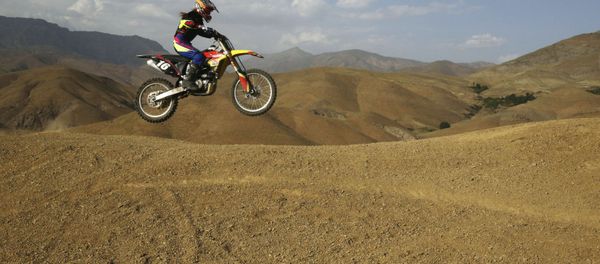 Iranian Behnaz Shafiei rides her motocross bike during her training session at a racetrack in the Alborz mountain range near the village of Baraghan, some 19 miles (30 kilometers) west of the capital Tehran, Iran Iranian Behnaz Shafiei rides her motocross bike during her training session at a racetrack in the Alborz mountain range near the village of Baraghan, some 19 miles (30 kilometers) west of the capital Tehran, Iran - Sputnik International