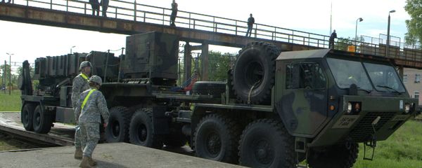 Soldiers watch a US Patriot missile being unloaded in a Polish Army military unit in Morag, northern Poland - Sputnik International