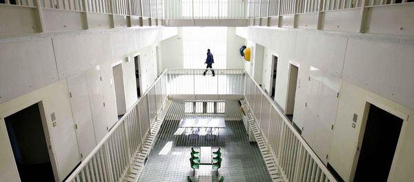 A security guard walks around the long-term wing at the new Colnbrook Immigration Removal Centre near London's Heathrow Airport A security guard walks around the long-term wing at the new Colnbrook Immigration Removal Centre near London's Heathrow Airport - Sputnik International