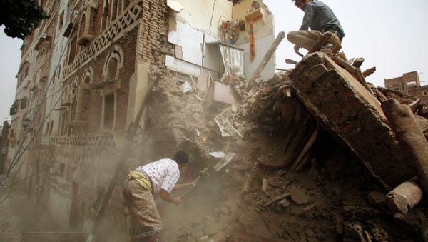A man searches for survivors under the rubble of houses destroyed by Saudi airstrikes in the old city of Sanaa, Yemen, Friday, June 12, 2015 A man searches for survivors under the rubble of houses destroyed by Saudi airstrikes in the old city of Sanaa, Yemen, Friday, June 12, 2015 - Sputnik International