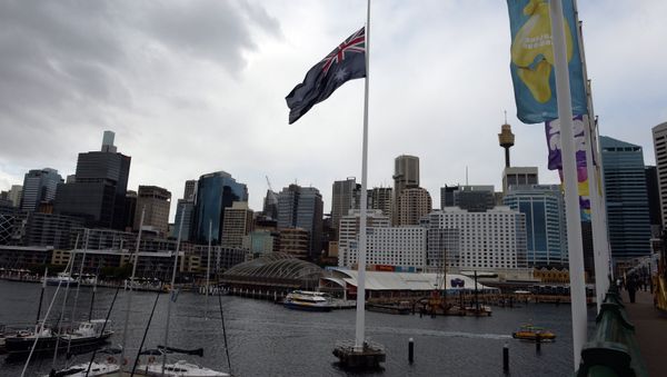 An Australian national flag flies in front of the city skyline at the Darling Harbour in Sydney on July 19, 2014 An Australian national flag flies in front of the city skyline at the Darling Harbour in Sydney on July 19, 2014 - Sputnik International