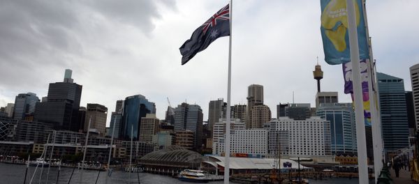 An Australian national flag flies in front of the city skyline at the Darling Harbour in Sydney on July 19, 2014 An Australian national flag flies in front of the city skyline at the Darling Harbour in Sydney on July 19, 2014 - Sputnik International