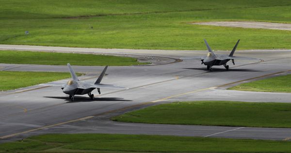 In this August 14, 2012 photo, two US Air Force F-22 Raptor stealth fighters taxi before take-off at Kadena Air Base on the southern island of Okinawa in Japan In this August 14, 2012 photo, two US Air Force F-22 Raptor stealth fighters taxi before take-off at Kadena Air Base on the southern island of Okinawa in Japan - Sputnik International