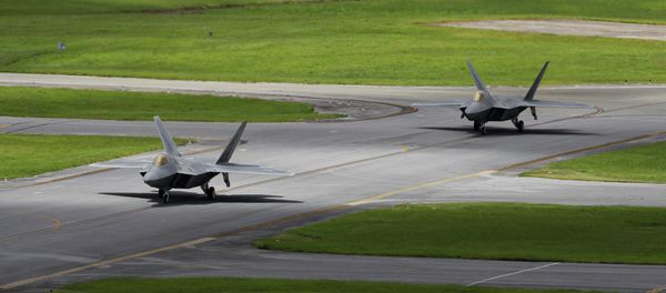 In this Aug. 14, 2012 photo, two U.S. Air Force F-22 Raptor stealth fighters taxi before take-off at Kadena Air Base on the southern island of Okinawa in Japan - Sputnik International