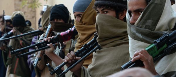 Afghan former Taliban fighters are photographed holding weapons before they hand them over as part of a government peace and reconciliation process at a ceremony in Jalalabad on February 8, 2015 Afghan former Taliban fighters are photographed holding weapons before they hand them over as part of a government peace and reconciliation process at a ceremony in Jalalabad on February 8, 2015 - Sputnik International