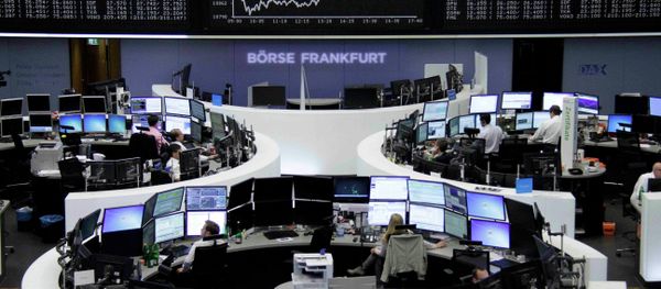 Traders work at their screens in front of the German share price index DAX board at the stock exchange in Frankfurt, Germany June 16, 2015 - Sputnik International