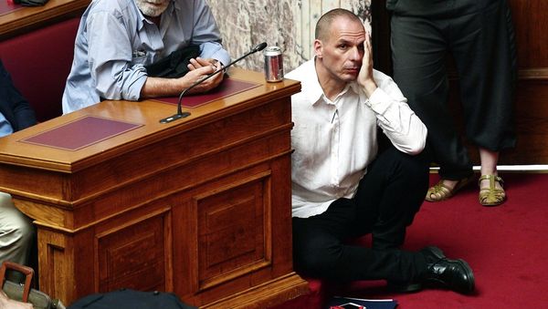 Greek Finance Minister Yianis Varoufakis (L) listens to Prime Minister addressing his MP's and ministers at the Greek Parliament in Athens on June 16, 2015. Greek Finance Minister Yianis Varoufakis (L) listens to Prime Minister addressing his MP's and ministers at the Greek Parliament in Athens on June 16, 2015. - Sputnik International