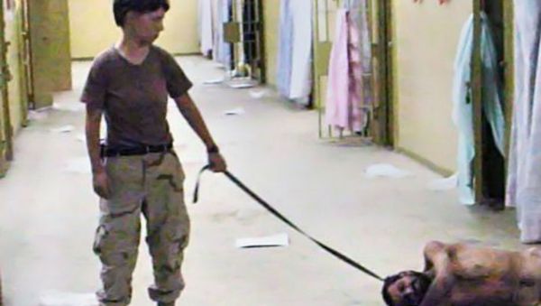 Specialist Lynndie England abusing an inmate in Abu Ghraib. Specialist Lynndie England abusing an inmate in Abu Ghraib. - Sputnik International