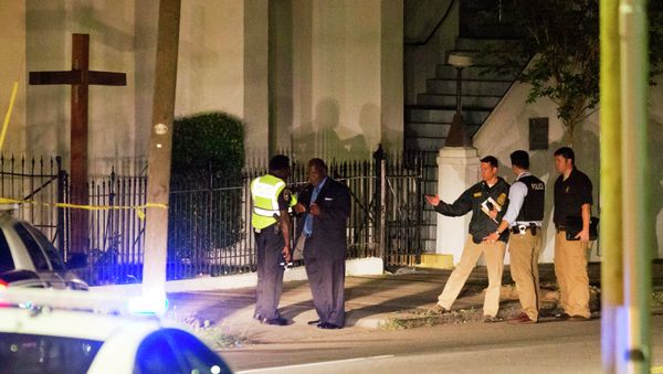 Police stand outside the Emanuel AME Church following a shooting Wednesday, June 17, 2015, in Charleston, S.C. Police stand outside the Emanuel AME Church following a shooting Wednesday, June 17, 2015, in Charleston, S.C. - Sputnik International