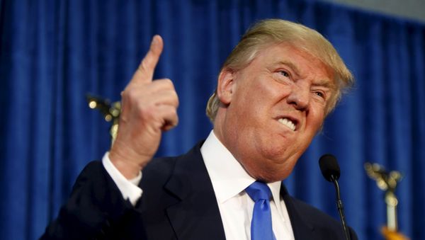 Republican presidential candidate Donald Trump gestures and declares You're fired! at a rally in Manchester, New Hampshire - Sputnik International