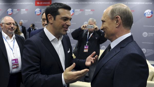 Greek Prime Minister Alexis Tsipras (L) speaks with Russian President Vladimir Putin during a session of the St. Petersburg International Economic Forum 2015 (SPIEF 2015) in St. Petersburg, Russia, June 19, 2015 - Sputnik International