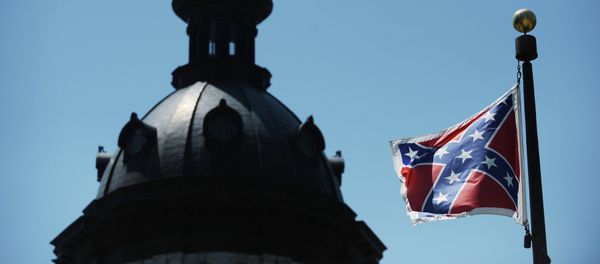 The Confederate flag flies near the South Carolina Statehouse, Friday, June 19, 2015, in Columbia, S.C. The Confederate flag flies near the South Carolina Statehouse, Friday, June 19, 2015, in Columbia, S.C. - Sputnik International