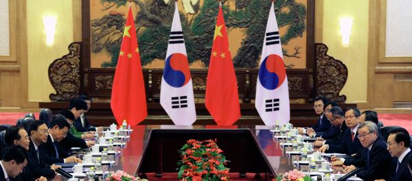 Chinese Premier Wen Jiabao (2nd L) and South Korea's President Lee Myung-bak (2nd R) attend a bilateral meeting during the fifth trilateral summit between China, South Korea and Japan at the Great Hall of the People in Beijing on May 13, 2012 Chinese Premier Wen Jiabao (2nd L) and South Korea's President Lee Myung-bak (2nd R) attend a bilateral meeting during the fifth trilateral summit between China, South Korea and Japan at the Great Hall of the People in Beijing on May 13, 2012 - Sputnik International