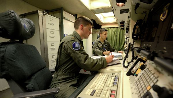 Oliver Parsons, left, and 1st Lt. Andy Parthum check systems in the underground control room where they work a 24-hour shift at an ICBM launch control facility near Minot. (File) Oliver Parsons, left, and 1st Lt. Andy Parthum check systems in the underground control room where they work a 24-hour shift at an ICBM launch control facility near Minot. (File) - Sputnik International