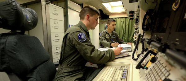 Oliver Parsons, left, and 1st Lt. Andy Parthum check systems in the underground control room where they work a 24-hour shift at an ICBM launch control facility near Minot. (File) Oliver Parsons, left, and 1st Lt. Andy Parthum check systems in the underground control room where they work a 24-hour shift at an ICBM launch control facility near Minot. (File) - Sputnik International