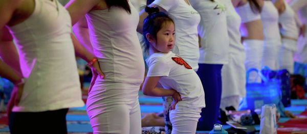 A child performs yoga at a hotel banquet hall to mark the International Yoga Day, in Changping District, on the outskirts of Beijing, China, Sunday, June 21, 2015 A child performs yoga at a hotel banquet hall to mark the International Yoga Day, in Changping District, on the outskirts of Beijing, China, Sunday, June 21, 2015 - Sputnik International