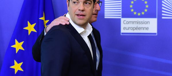 Greece's Prime Minister Alexis Tsipras (L) is welcomed by European Commission President Jean-Claude Juncker ahead of an emergency summit with the leaders of Athens' creditors at the European Commission in Brussels, on June 22, 2015. - Sputnik International