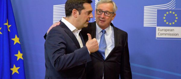 Greek Prime Minister Alexis Tsipras, left, speaks with European Commission President Jean-Claude Juncker as he arrives for a meeting prior to an EU summit at EU headquarters in Brussels - Sputnik International