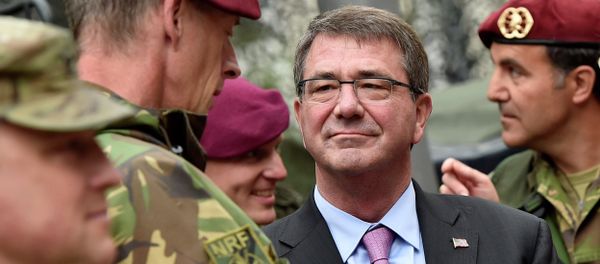 US Secretary of Defense Ash Carter, right, listens to NATO Response Force soldiers during his visit to Germany. US Secretary of Defense Ash Carter, right, listens to NATO Response Force soldiers during his visit to Germany. - Sputnik International