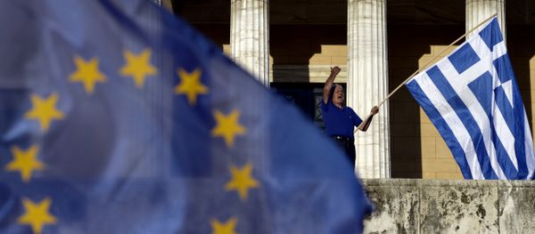 A protester shouts slogans during a pro-European demonstration in front of the Greek parliament in Athens on June 22, 2015. A protester shouts slogans during a pro-European demonstration in front of the Greek parliament in Athens on June 22, 2015. - Sputnik International