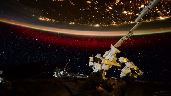 Stationed aboard the International Space Station, US Astronaut Scott Kelly has captured eerie and beautiful photo and video materials of a rare red aurora from 400km above Earth's atmosphere. Stationed aboard the International Space Station, US Astronaut Scott Kelly has captured eerie and beautiful photo and video materials of a rare red aurora from 400km above Earth's atmosphere. - Sputnik International