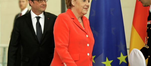 German Chancellor Angela Merkel, right, and the President of France, Francois Hollande, left, arrive for a joint press conference as part of a meeting at the Chancellery in Berlin, Germany, Tuesday, May 19, 2015 German Chancellor Angela Merkel, right, and the President of France, Francois Hollande, left, arrive for a joint press conference as part of a meeting at the Chancellery in Berlin, Germany, Tuesday, May 19, 2015 - Sputnik International