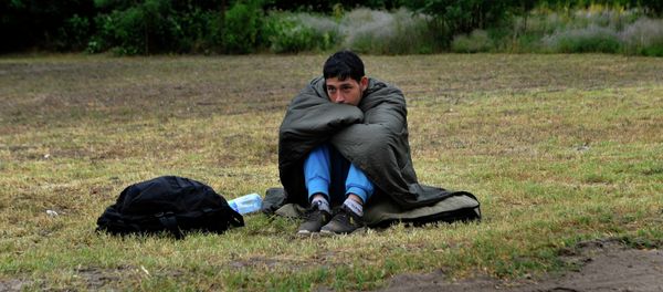 An Afghan refugee rests on the Hungarian Serbian border area near Asotthalom, Hungary. An Afghan refugee rests on the Hungarian Serbian border area near Asotthalom, Hungary. - Sputnik International