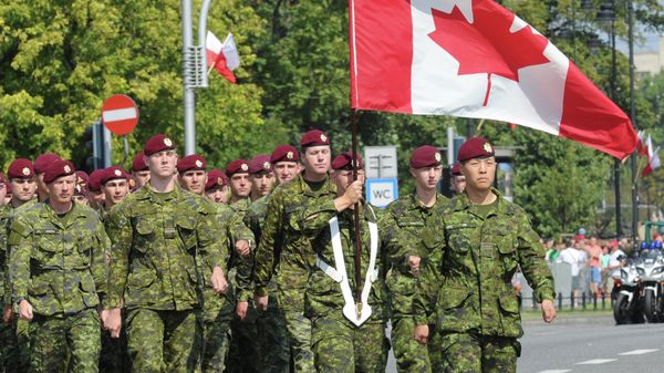 A military unit from Canada marches during a military parade marking Polish Armed Forces Day, in Warsaw, Poland, Friday, Aug. 15, 2014 - Sputnik International