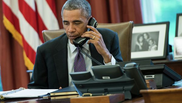 US President Barack Obama speaks on the phone in the Oval Office of the White House US President Barack Obama speaks on the phone in the Oval Office of the White House - Sputnik International