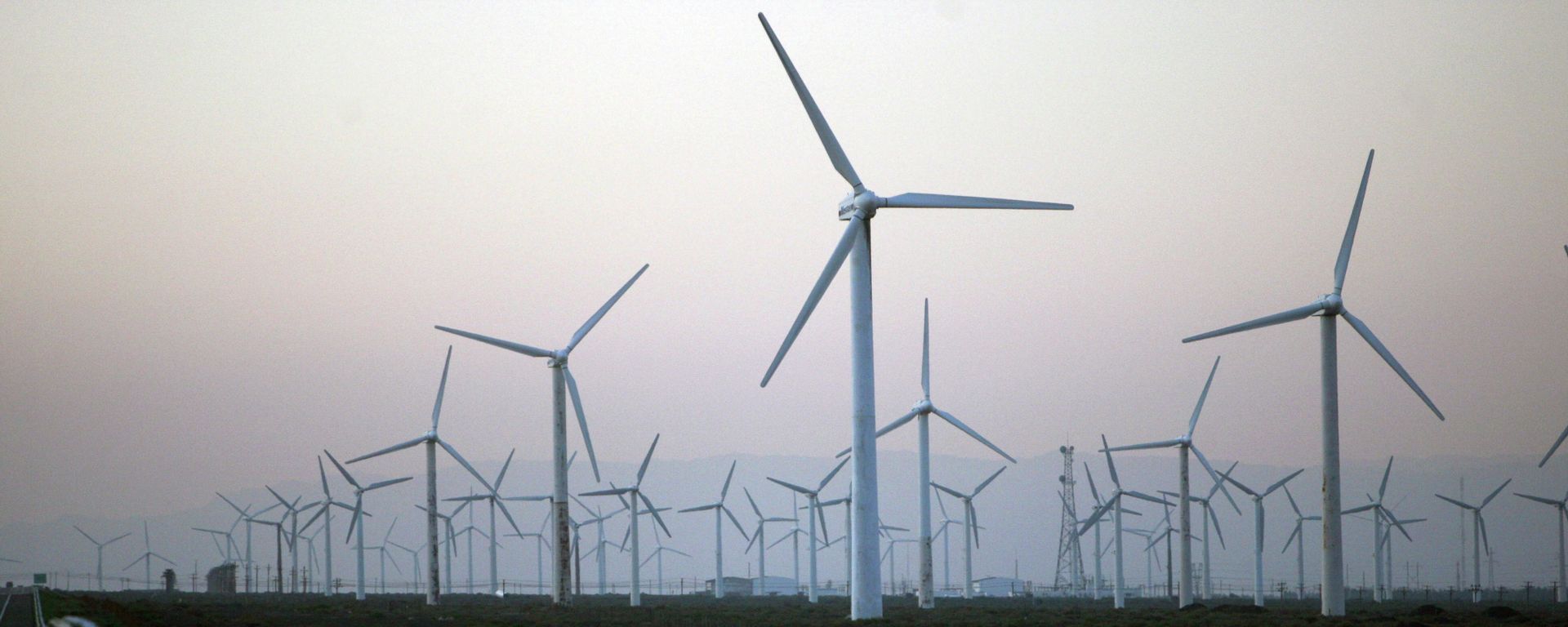 Wind turbines produced by Goldwind Science & Technology Ltd. are seen at the Da Bancheng Wind Farm, south of Urumqi, in Xinjiang, China Wind turbines produced by Goldwind Science & Technology Ltd. are seen at the Da Bancheng Wind Farm, south of Urumqi, in Xinjiang, China - Sputnik International, 1920, 23.12.2020