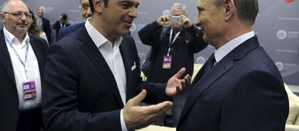 Greek Prime Minister Alexis Tsipras (L) speaks with Russian President Vladimir Putin during a session of the St. Petersburg International Economic Forum 2015 (SPIEF 2015) in St. Petersburg, Russia, June 19, 2015 - Sputnik International