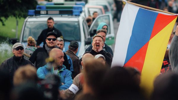 In this June 24, 2016 protestors demonstrate against the accommodation of migrants in Freital near Dresden, eastern Germany In this June 24, 2016 protestors demonstrate against the accommodation of migrants in Freital near Dresden, eastern Germany - Sputnik International