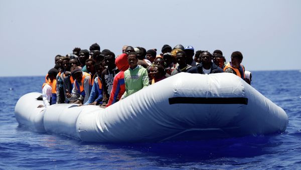 A rubber boat loaded of migrants is seen during a search and rescue mission in the mediterranean sea off the Libyan coasts, Italy, Tuesday, June 23, 2015 A rubber boat loaded of migrants is seen during a search and rescue mission in the mediterranean sea off the Libyan coasts, Italy, Tuesday, June 23, 2015 - Sputnik International