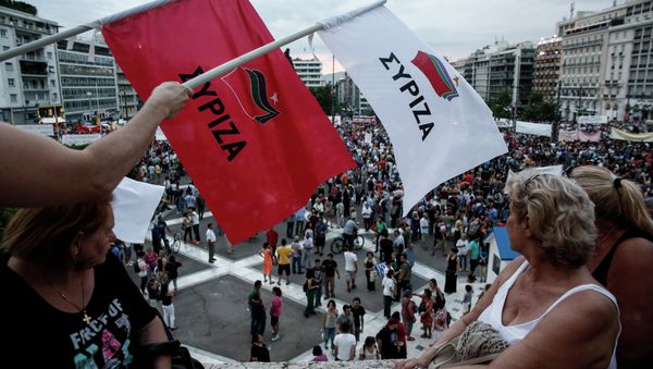 Anti-austerity protesters wave flags of the ruling Syriza party during a rally outside the parliament in Athens, Greece, on Sunday, June 21, 2015 Anti-austerity protesters wave flags of the ruling Syriza party during a rally outside the parliament in Athens, Greece, on Sunday, June 21, 2015 - Sputnik International