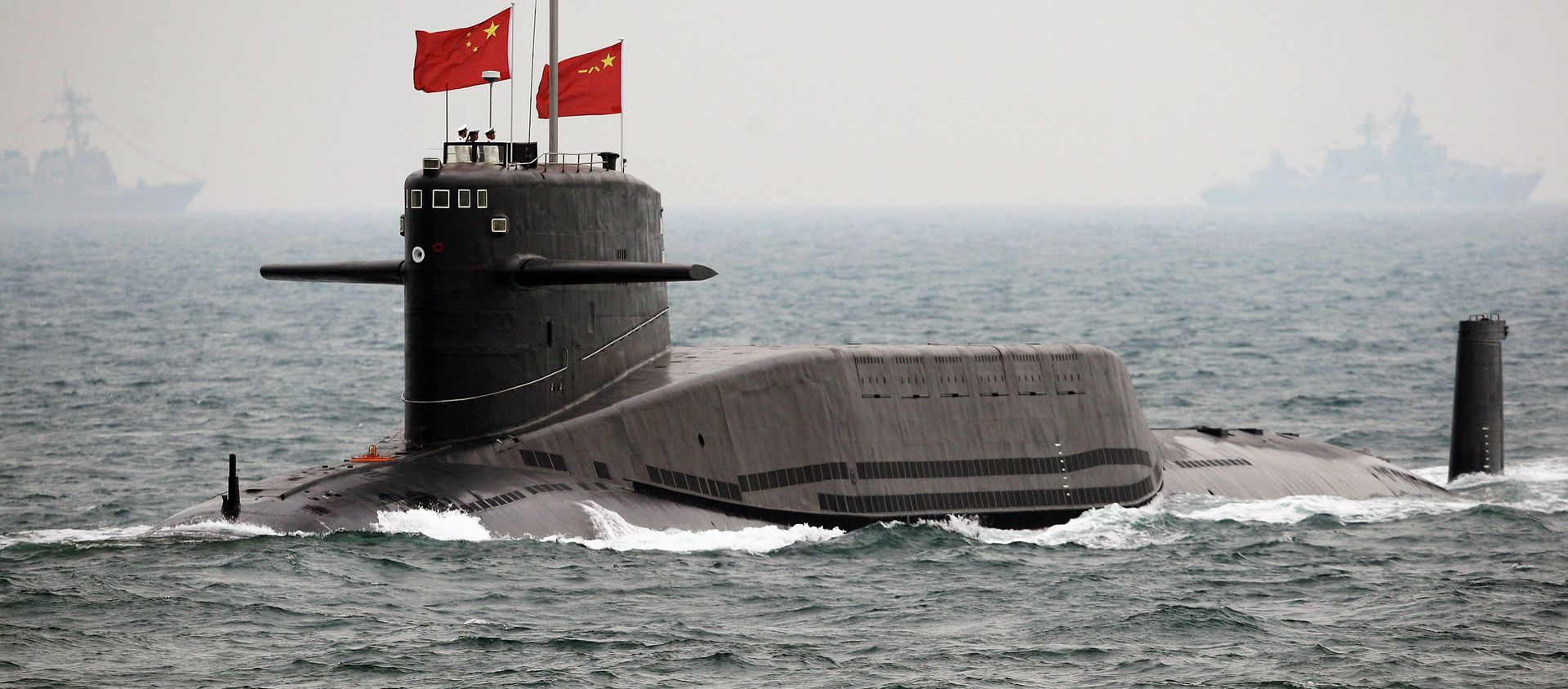 File photo, a Chinese Navy nuclear-powered submarine sails during an international fleet review to celebrate the 60th anniversary of the founding of People's Liberation Army Navy - Sputnik International, 1920, 01.08.2019