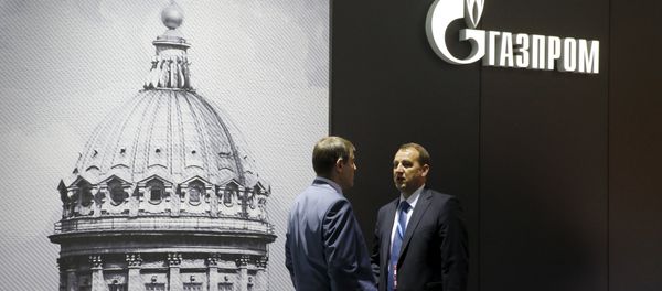 Men speak near the pavilion of Gazprom company at the St. Petersburg International Economic Forum 2015 (SPIEF 2015) in St. Petersburg, Russia, June 18, 2015 - Sputnik International