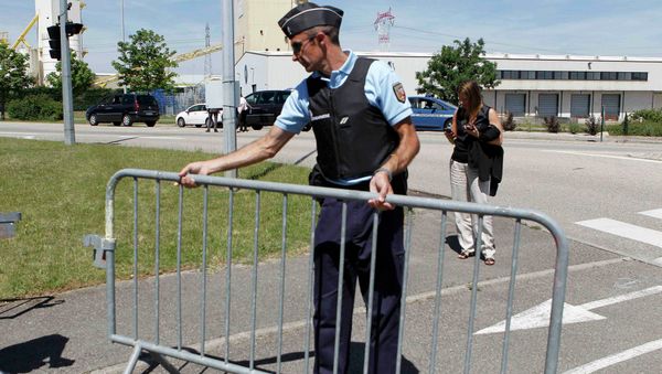 A French Gendarme blocks the access road to the Saint-Quentin-Fallavier industrial area, near Lyon, France, June 26, 2015 A French Gendarme blocks the access road to the Saint-Quentin-Fallavier industrial area, near Lyon, France, June 26, 2015 - Sputnik International