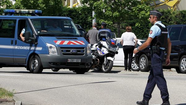 A French Gendarme blocks the access road to the Saint-Quentin-Fallavier industrial area, near Lyon, France, June 26, 2015 A French Gendarme blocks the access road to the Saint-Quentin-Fallavier industrial area, near Lyon, France, June 26, 2015 - Sputnik International