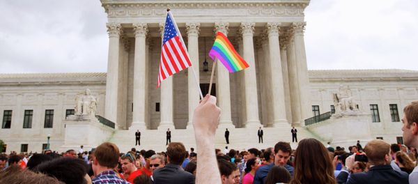 The crowd celebrates outside of the Supreme Court in Washington, Friday June 26, 2015, after the court declared that same-sex couples have a right to marry anywhere in the US - Sputnik International