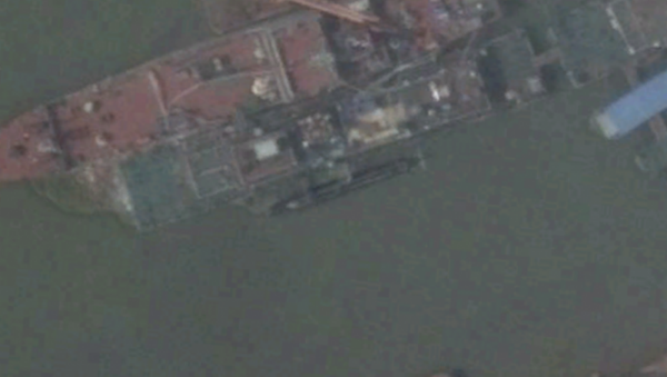 Satellite imagery shows what appears to be a new midget submarine at China’s Wuchang shipyard. Satellite imagery shows what appears to be a new midget submarine at China’s Wuchang shipyard. - Sputnik International