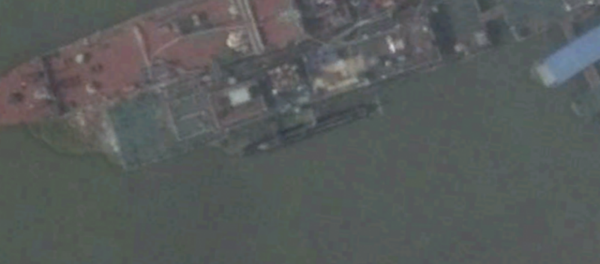Satellite imagery shows what appears to be a new midget submarine at China’s Wuchang shipyard. Satellite imagery shows what appears to be a new midget submarine at China’s Wuchang shipyard. - Sputnik International