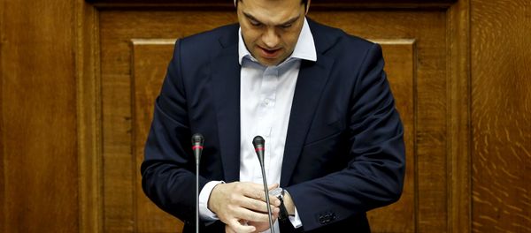 Greek Prime Minister Alexis Tsipras looks at his watch as he delivers a speech during a parliamentary session in Athens, Greece in this June 28, 2015 Greek Prime Minister Alexis Tsipras looks at his watch as he delivers a speech during a parliamentary session in Athens, Greece in this June 28, 2015 - Sputnik International