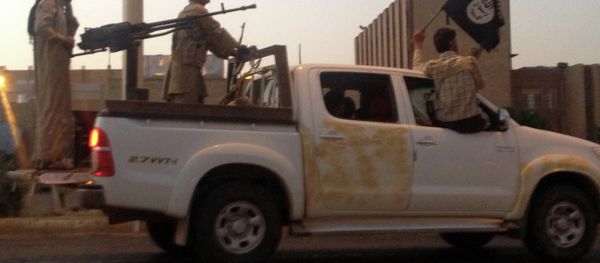 Islamic State militants parade in a commandeered Iraqi security forces vehicle on a main road at the northern city of Mosul. Islamic State militants parade in a commandeered Iraqi security forces vehicle on a main road at the northern city of Mosul. - Sputnik International