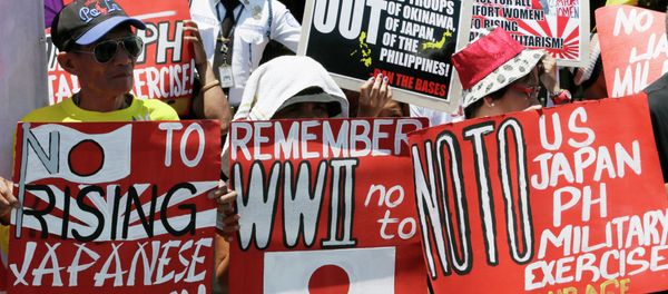 Protesters display placards during a rally outside the Japanese Embassy to protest the ongoing naval exercises by Japan and the United States. Protesters display placards during a rally outside the Japanese Embassy to protest the ongoing naval exercises by Japan and the United States. - Sputnik International