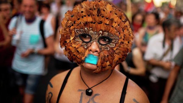 A protester takes part in a march against the Public Security Law gag law in Madrid, Spain, Tuesday, June 30, 2015. - Sputnik International
