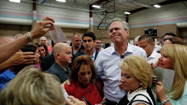 Republican presidential candidate, former Florida Gov. Jeb Bush reacts while meeting people after speaking at a campaign event Saturday, June 27, 2015, in Henderson, Nev. Republican presidential candidate, former Florida Gov. Jeb Bush reacts while meeting people after speaking at a campaign event Saturday, June 27, 2015, in Henderson, Nev. - Sputnik International