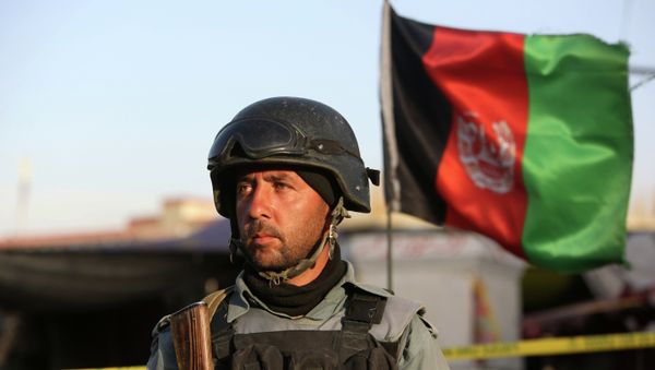 Afghan security forces inspect the site after a suicide car bombing attack in Kabul, Afghanistan, Tuesday, May 19, 2015. Afghan security forces inspect the site after a suicide car bombing attack in Kabul, Afghanistan, Tuesday, May 19, 2015. - Sputnik International