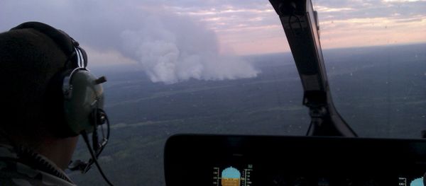An aerial view from a helicopter shows smoke from forest fires some 40 km from Chernobyl nuclear power plant in Kiev region, northern Ukraine, June 29, 2015. Picture taken with a mobile phone on June 29, 2015 An aerial view from a helicopter shows smoke from forest fires some 40 km from Chernobyl nuclear power plant in Kiev region, northern Ukraine, June 29, 2015. Picture taken with a mobile phone on June 29, 2015 - Sputnik International