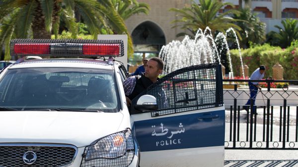 A Tunisian police car patrols in front of the Riu Imperial Marhaba Hotel in Port el Kantaoui, on the outskirts of Sousse south of the capital Tunis, on June 27, 2015 A Tunisian police car patrols in front of the Riu Imperial Marhaba Hotel in Port el Kantaoui, on the outskirts of Sousse south of the capital Tunis, on June 27, 2015 - Sputnik International